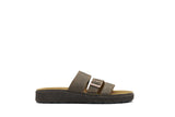 A single dark brown double-strap slide sandal with a metallic buckle detail, shown from a side profile on a solid white background.