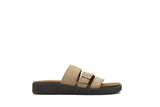Tan sandal with a black sole on a white background