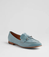 A light blue patent leather penny loafer with silver-tone tassel details, shown from a three-quarters angle on a light gray background.