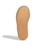 Close-up of a tan shoe sole on a white background