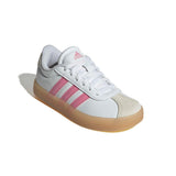 A white Adidas low-top sneaker with pink three-stripes and a translucent gum sole, shown on a white background with a soft shadow.