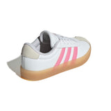 A white Adidas low-top sneaker with three pink stripes, a beige heel tab, and a translucent gum sole, shown from a three-quarters angle on a white background.