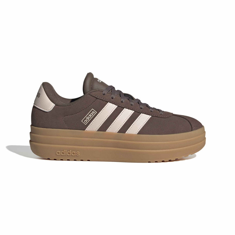 An Adidas platform sneaker in dark brown suede with beige stripes and a thick tan gum sole, shown from a side profile on a white background.