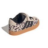 A single Adidas sneaker shown from a three-quarters rear angle on a white background. The shoe features a beige and black leopard print upper, a beige suede toe cap, black side stripes, a black hook-and-loop strap closure, and a brown gum sole.