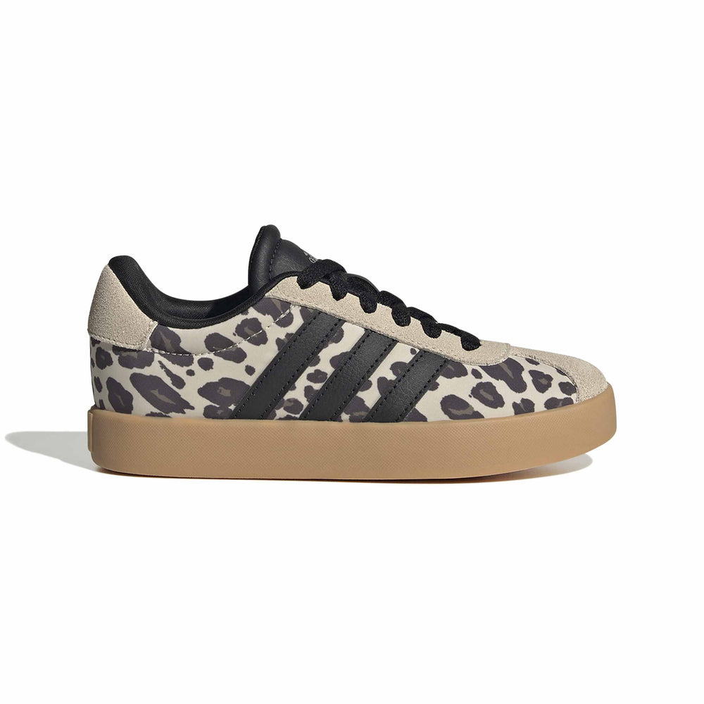 Black and green sneaker on a light gray background
