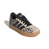 An Adidas low-top sneaker featuring a beige and black leopard print pattern on the side panels, black suede stripes, black laces, and a gum sole, shown on a white background with a soft shadow.