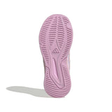 A single shoe sole shown from the bottom view, featuring a textured tread pattern and a subtle embossed Adidas logo in a light lavender purple color, set against a plain white background with a soft shadow.