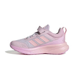 A light pink and lavender Adidas running shoe with a hook-and-loop strap closure, shown in a side profile on a white background.