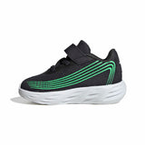 A toddler's black mesh sneaker with a hook-and-loop strap, featuring bright green curved stripe accents on the side and a thick white sole, shown against a plain white background.