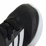 Black and white running shoe with Adidas logo on a white background