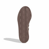 Black sneaker sole with white stripes on a light gray background