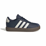 A navy blue low-top sneaker with three white stripes on the side, a dark brown sole, and a light gray heel tab, shown from a side profile on a white background.