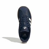 A single Adidas sport shoe in navy blue with white stripes and white branding, shown from a top-down view on a white background with a soft shadow.