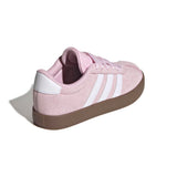 Pink Adidas sneaker with white stripes on a white background