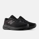 Black running shoes with New Balance logo on a light gray background