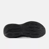 Black shoe sole with unique tread pattern on a white background